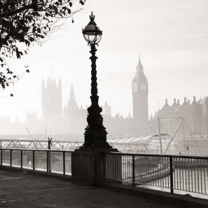 Heavy fog hits London Palace of Westminster in fog seen from South Bank