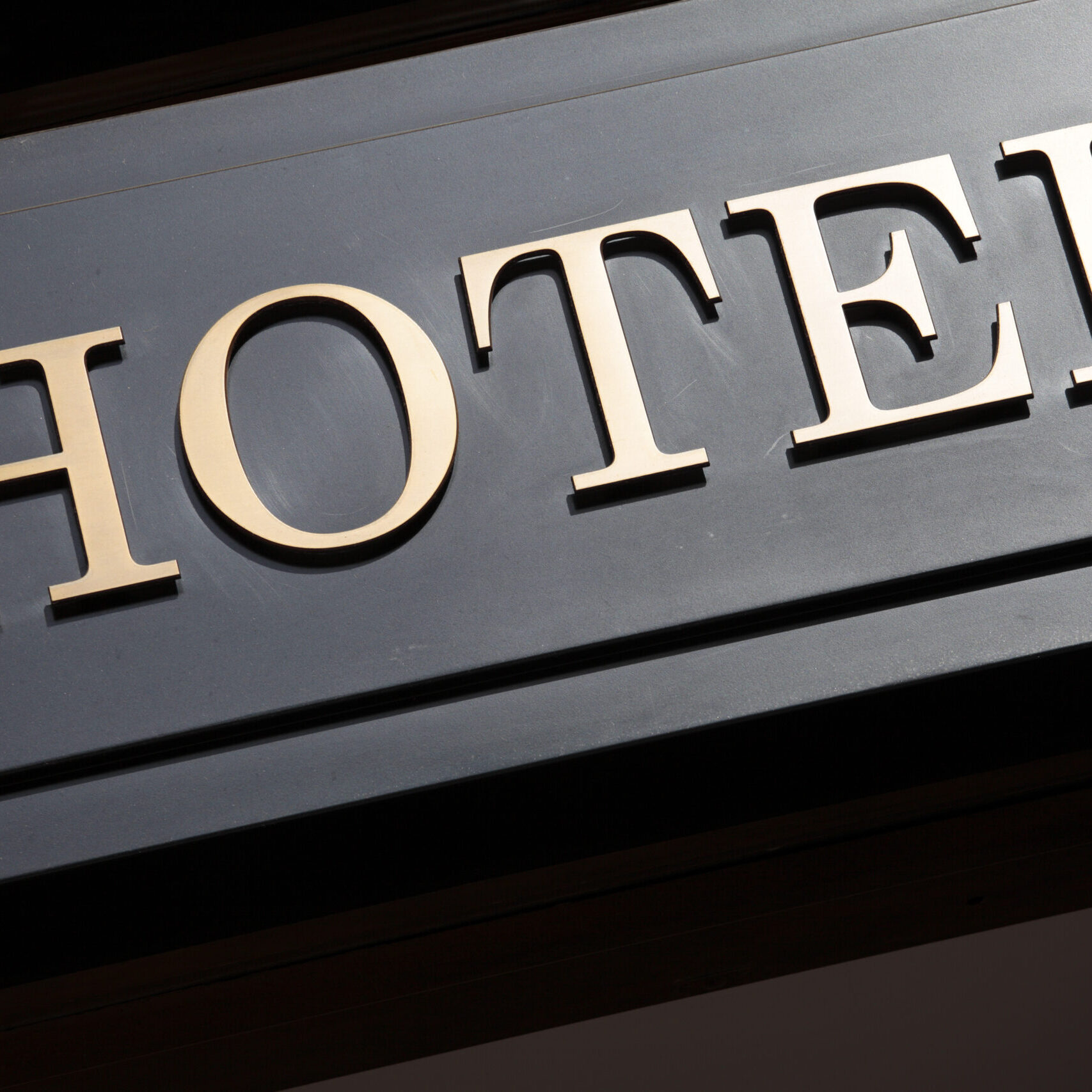 Hotel entrance sign Hotel entrance sign. Photo taken in late afternoon directional light.